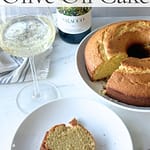 Marcella Hazan olive oil cake with slice served alongside Moscato d’Asti sparkling wine.