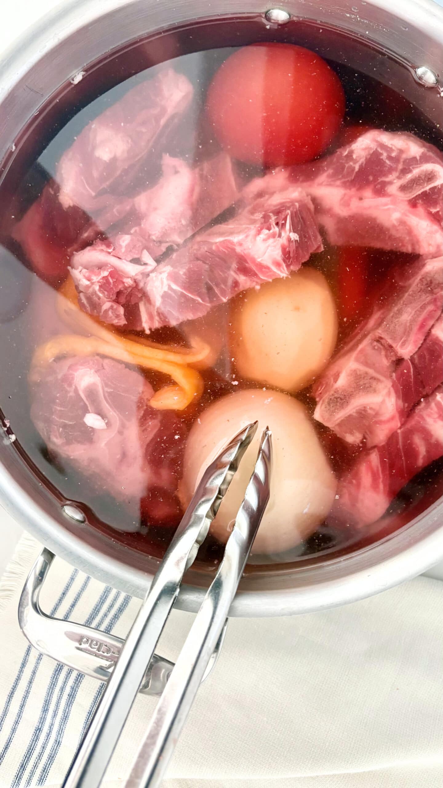 homemade beef broth simmering in large pot