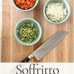 Chopped onion, carrot, and celery in bowls on a cutting board for soffritto