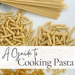 Dried spaghetti, fusilli, casarecce, and penne arranged on a white marble surface with the text "A Guide to Cooking Pasta."