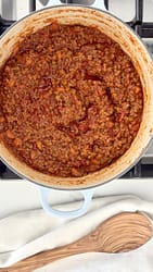cooking bolognese meat sauce in Dutch oven