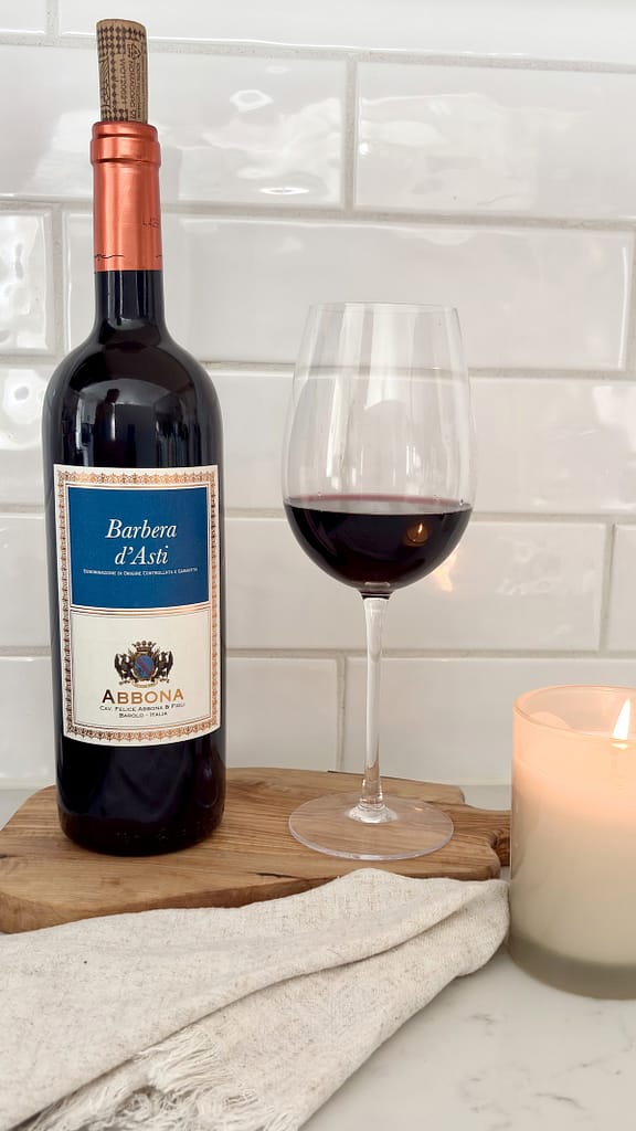 Barbera wine bottle and glass for Italian food pairing