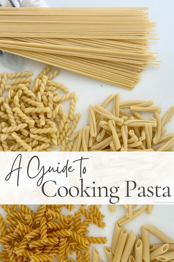 Dried spaghetti, fusilli, casarecce, and penne arranged on a white marble surface with the text "A Guide to Cooking Pasta."