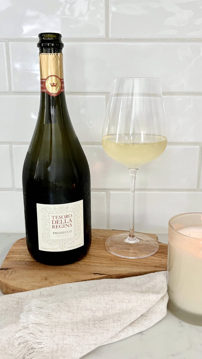 Glass of Prosecco being poured, Italian sparkling wine for appetizer and bruschetta pairing.